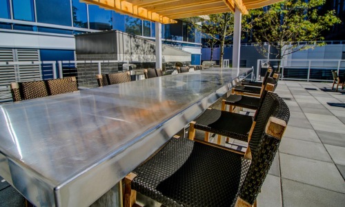 outdoor patio with grills and eating area