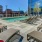 lounge chairs surrounding rooftop pool