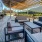 a deck with chairs and tables