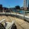 chairs on rooftop deck overlooking waterway